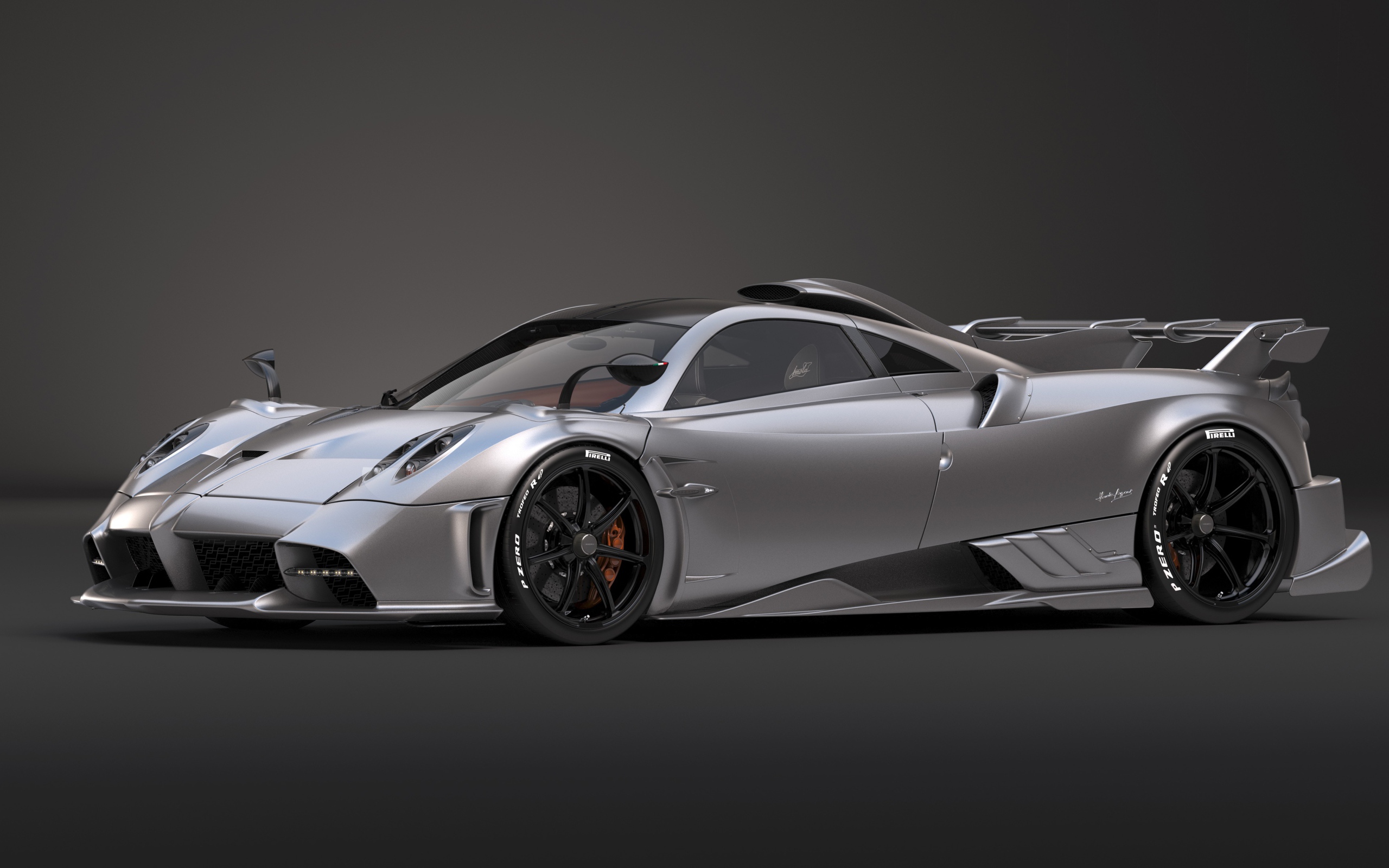 Серебристый автомобиль Pagani Imola 2020 года на сером фоне