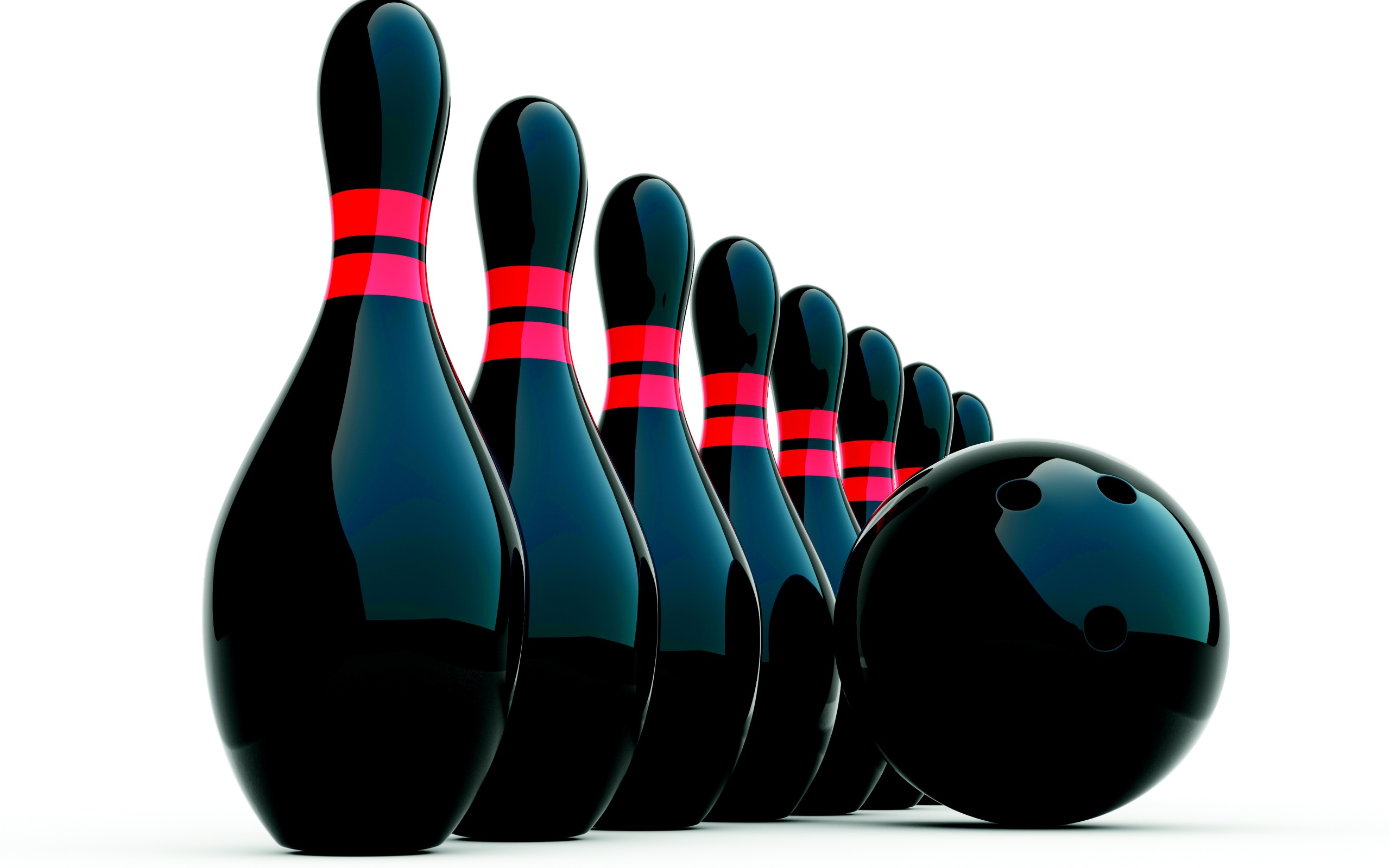 Черные кегли и шар для боулинга на белом фоне