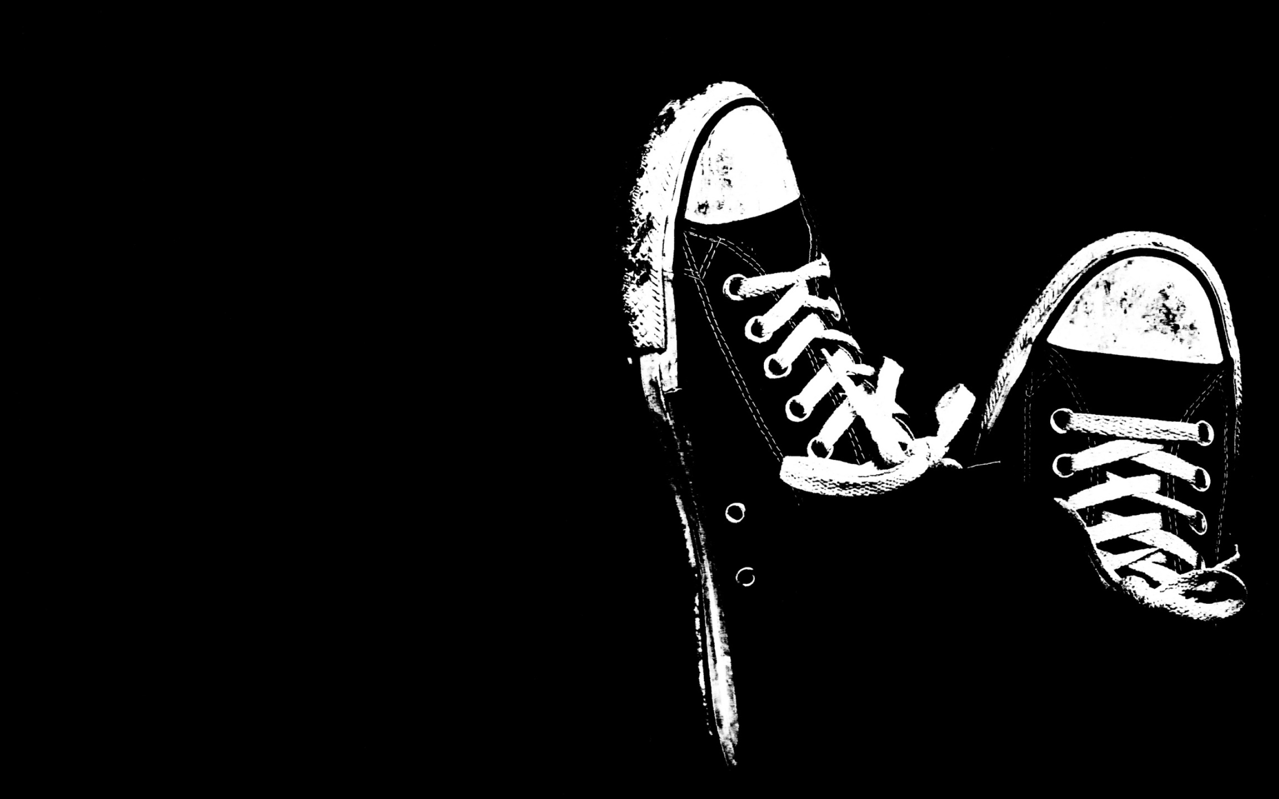 White sneakers on a black background