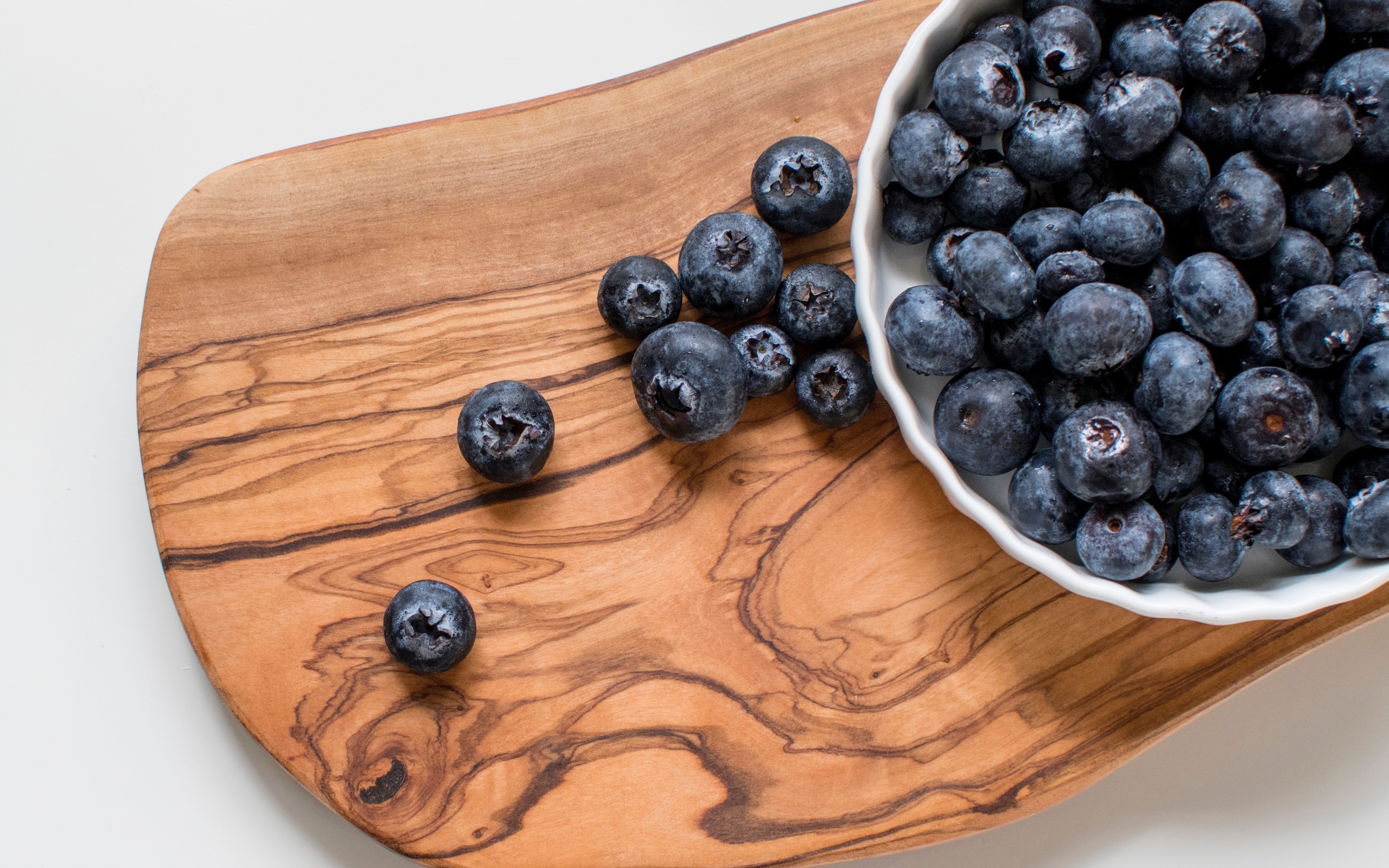 Ripe large blueberries on the board
