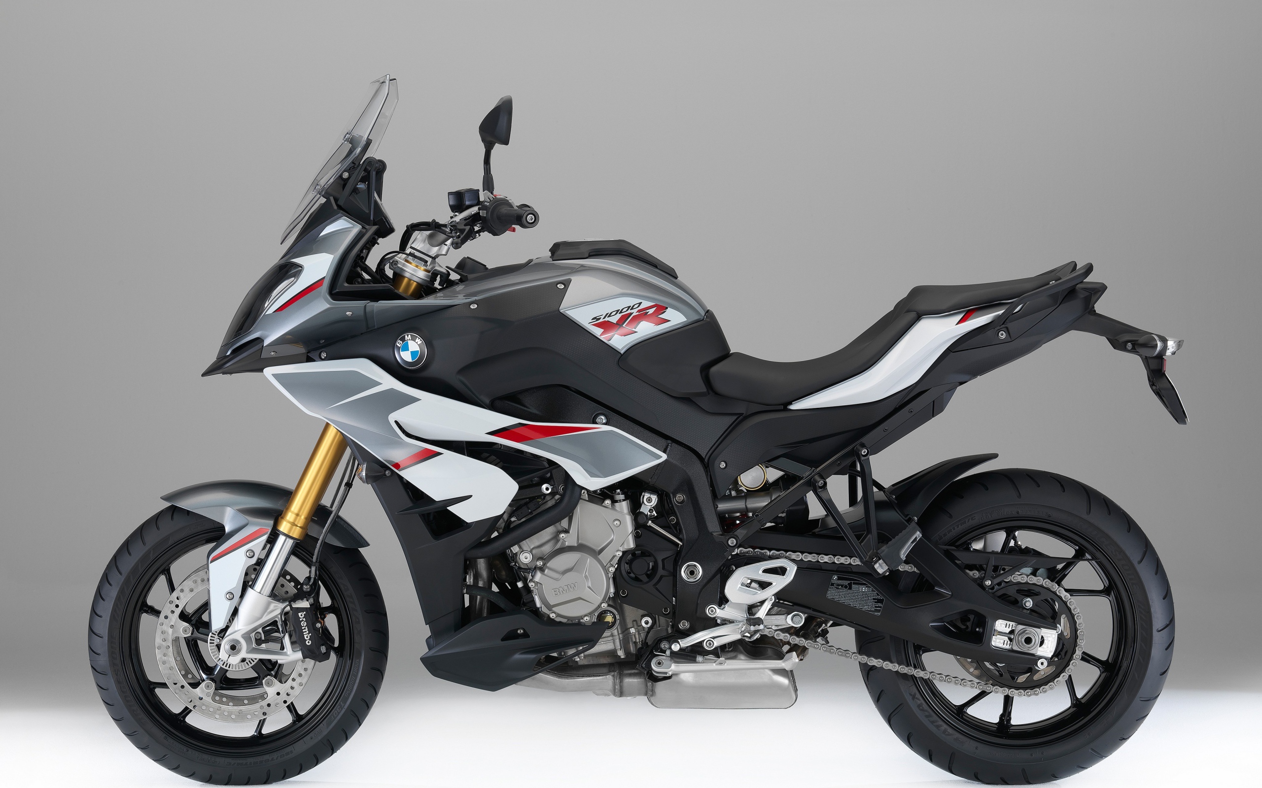 BMW S1000 racing motorcycle on a gray background