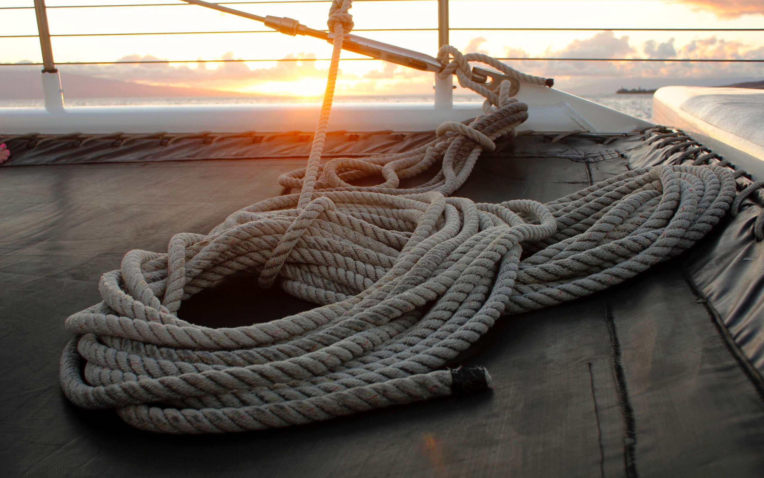A harpoon with a rope lies on board the yacht