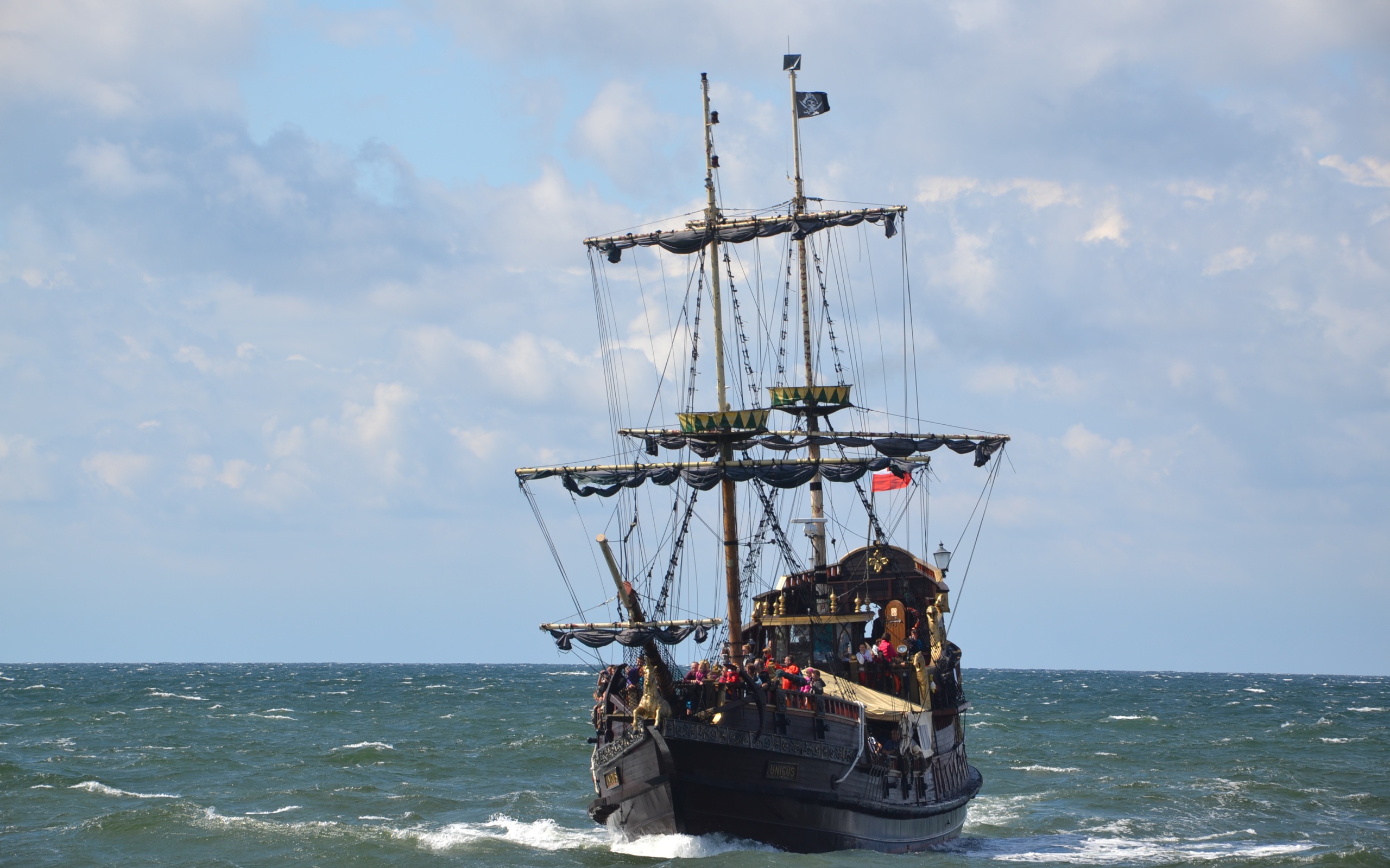 Big black pirate ship at sea