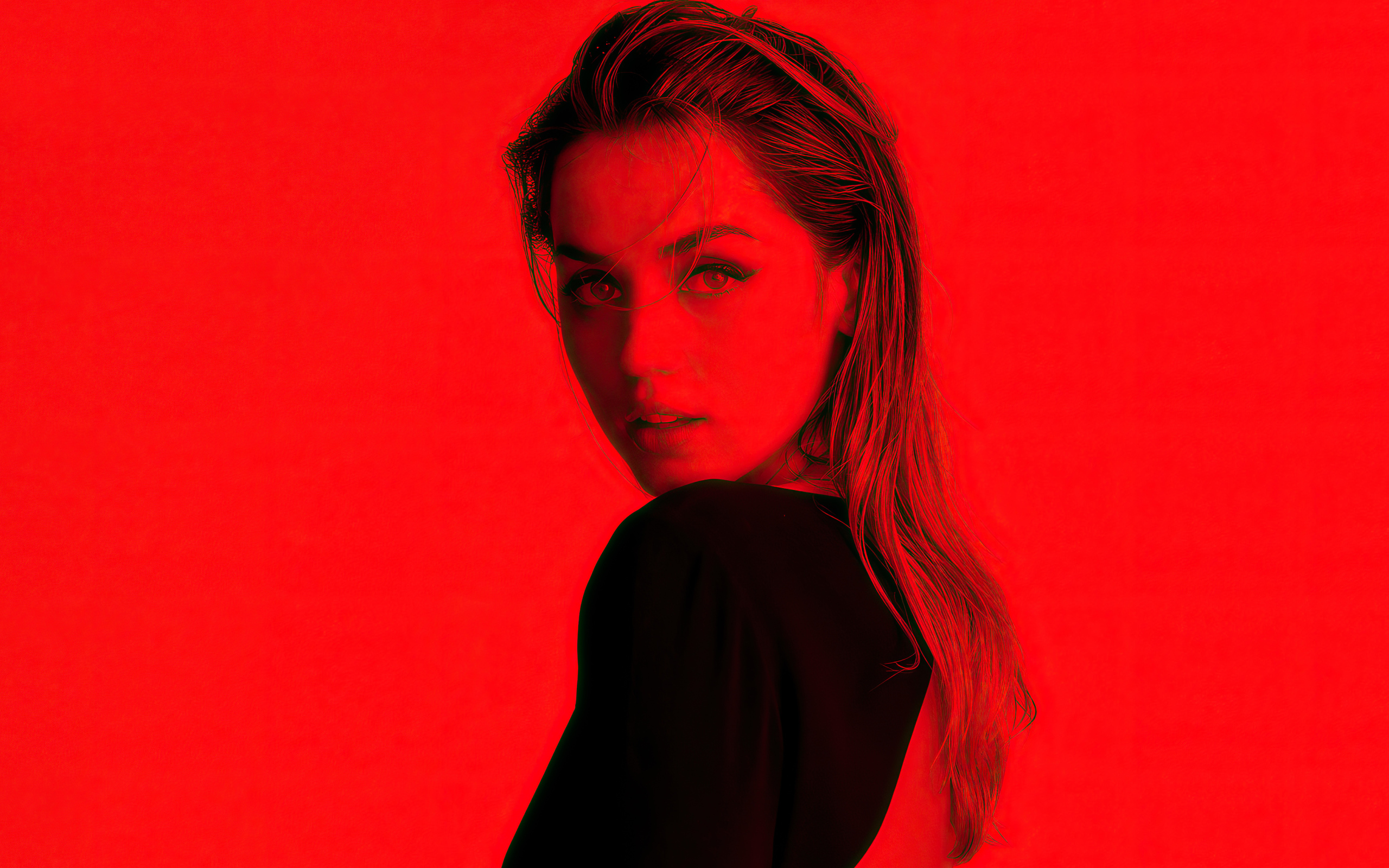 Испанская актриса Ана де Армас на красном фоне