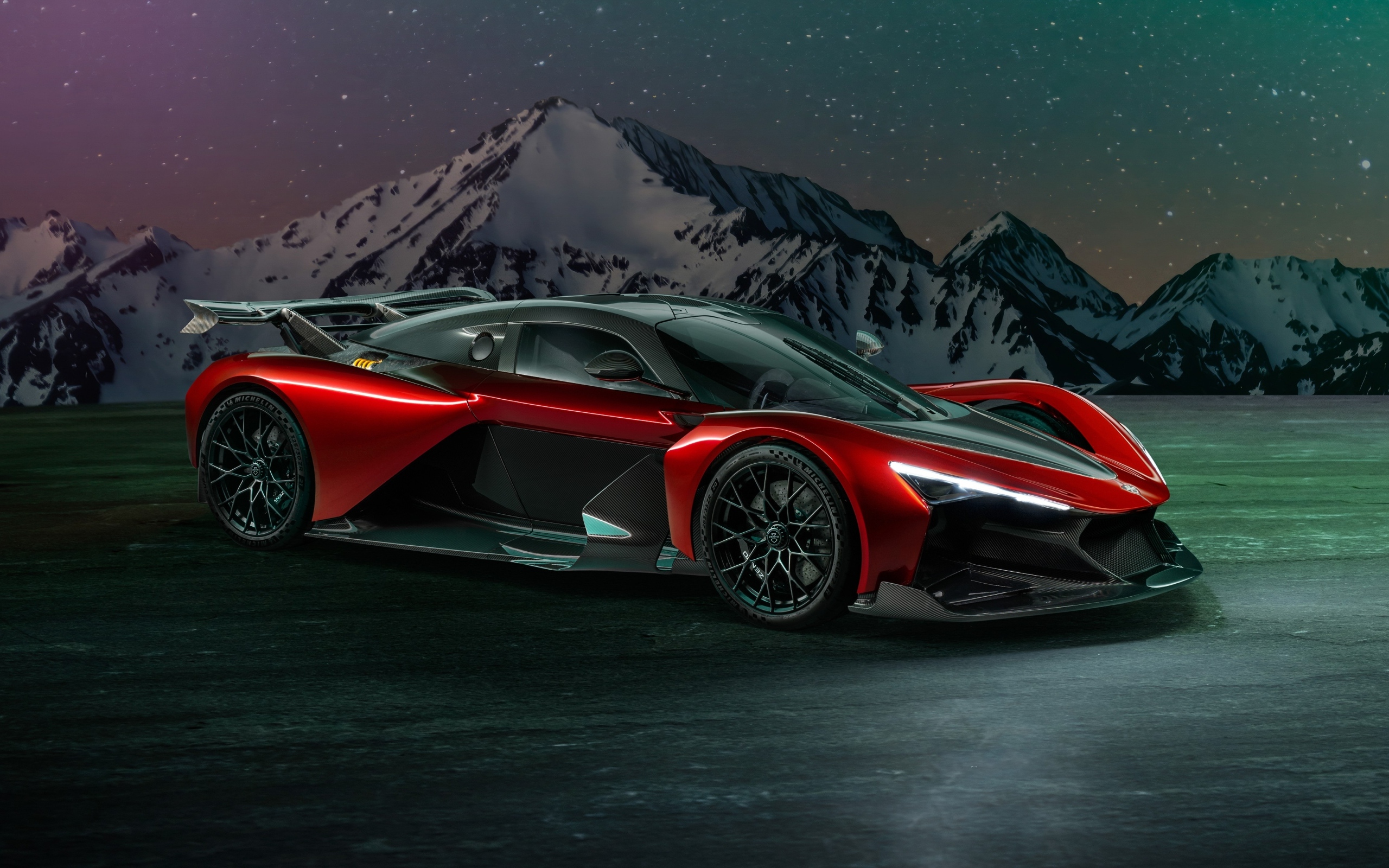 Красный спорткар Zenvo Aurora Agil  на фоне гор