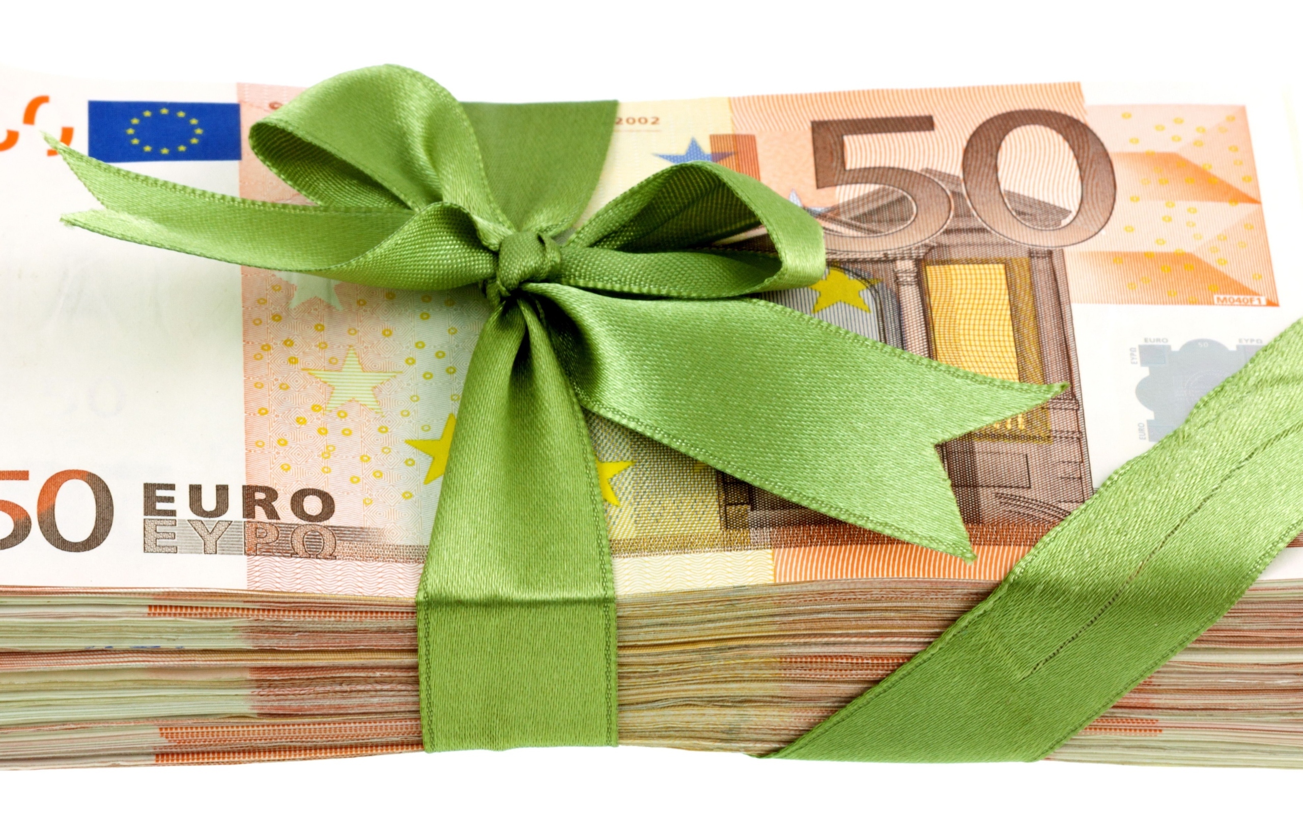 Bundle of euros tied with a green ribbon