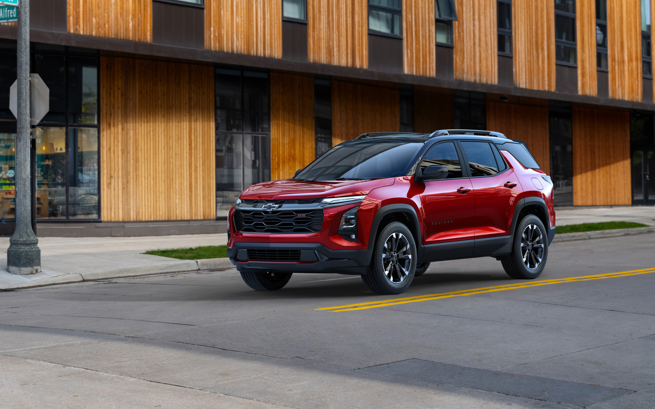 Красный автомобиль Chevrolet Equinox RS 2025 года