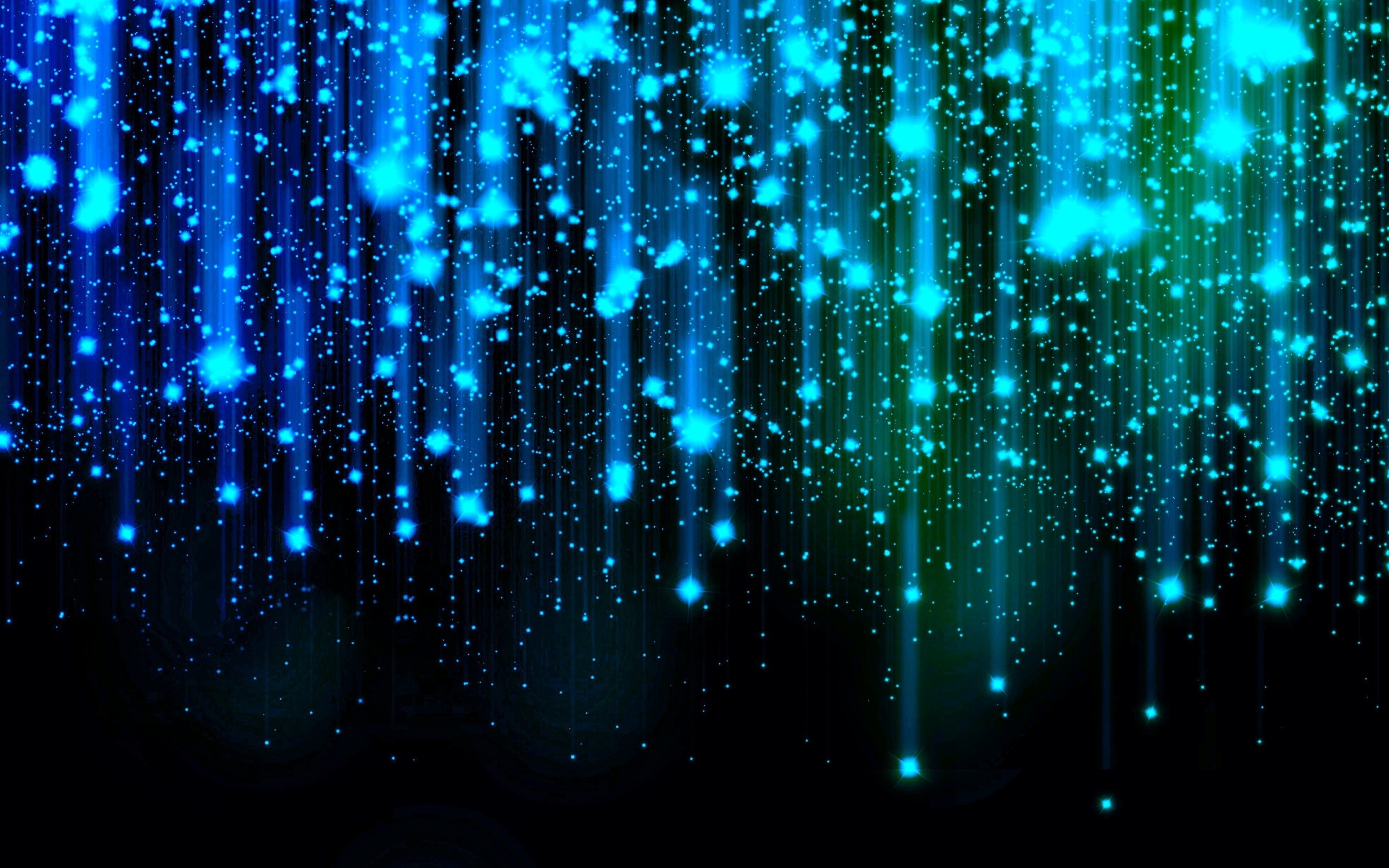 Яркие искры летят вниз на черном фоне