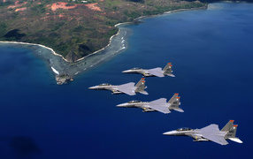 Military aircraft / flight over the coastline