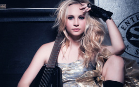 Candice Accola with an electric guitar