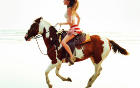Gisele Bundchen on a horse