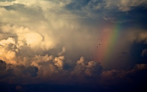 Clouds and rainbow