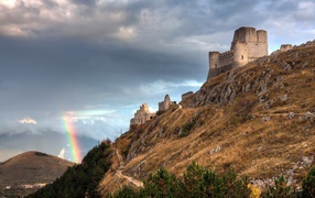 Rainbow and Castle in the mountains