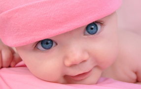 A girl in a pink cap