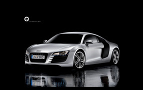 Белый Ауди на черном фоне