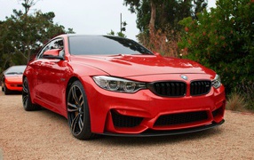 Red BMW M4 at the party
