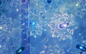 Glass snowflakes on a blue background on Christmas