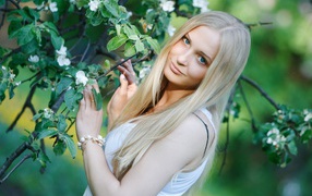 The blonde at a blossoming tree