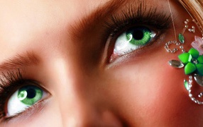 With emerald green eyes