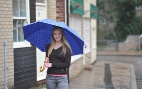 Model with a blue umbrella