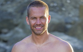 Famous Actor from the movie Furious Paul Walker near the waterfall
