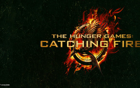 Голодные игры возгорания: логотип в зеленом фоне