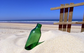 Bottle in sand