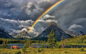 Rainbow over the mountain lake
