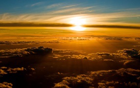 Golden sunset above the clouds