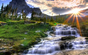 Sunset at a cascading waterfall