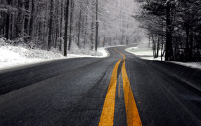 Winter road in cloudy weather