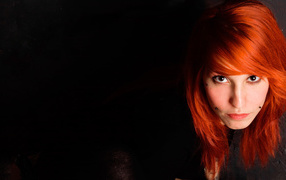 Beautiful red-haired girl with piercing on her face