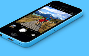 Blue Iphone 5C on a blue background