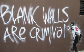 Graffiti, policeman lawbreaker, artist Banksy