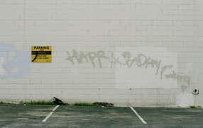 Graffiti on the white wall, happy birthday