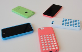 New smartphones Iphone 5C and cases from Apple on the table