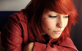 Red-haired girl with piercing on her face