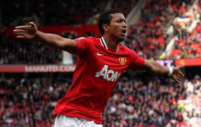 The halfback of Manchester United Luis Nani is flying over the field