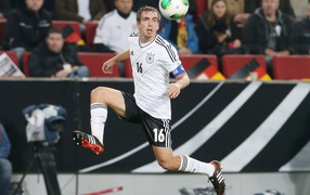 The player of Bayern Philipp Lahm trying to hit the ball