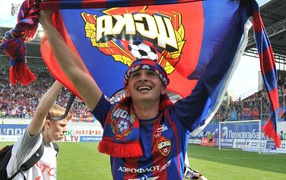 The player of CSKA Alan Dzagoev with CSKA flag