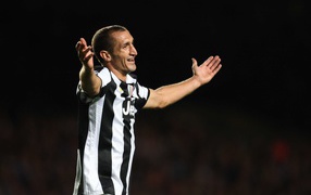 The player of Juventus Giorgio Chiellini on black background