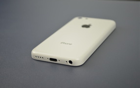 White Iphone 5C on a gray table