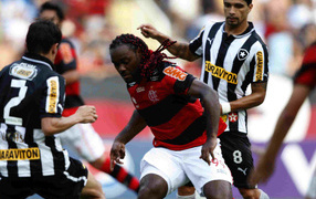 The player of Shandong Luneng Vagner battling for the ball