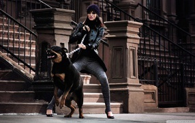 Girl holding a Rottweiler