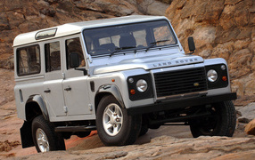 Vehicle Land Rover Defender on the road 