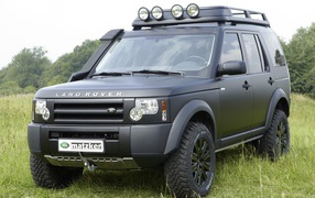  Vehicle Land Rover Defender on the road 