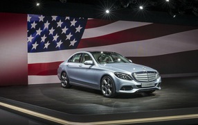 Mercedes C class in 2014 against the background of the USA flag