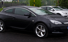 Opel Astra GTC car on the road 