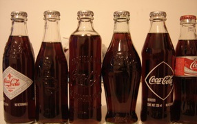 	   Different bottles of Coca - Cola