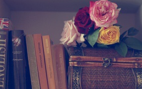 Roses on the casket and books